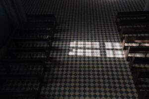 black and white checkered floor inside a church building