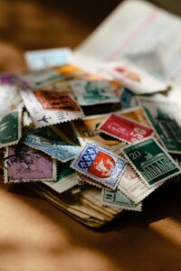 A pile of postage stamps in dappled sunlight